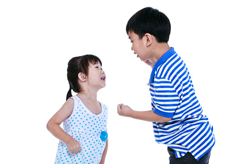 Quarreling conflict between brother and sister. Asian children are arguing and fighting. Concept about family & relationship problems. Isolated on white background.