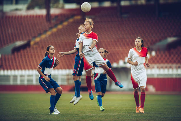 istock Heading the ball on woman's soccer match! 876886642