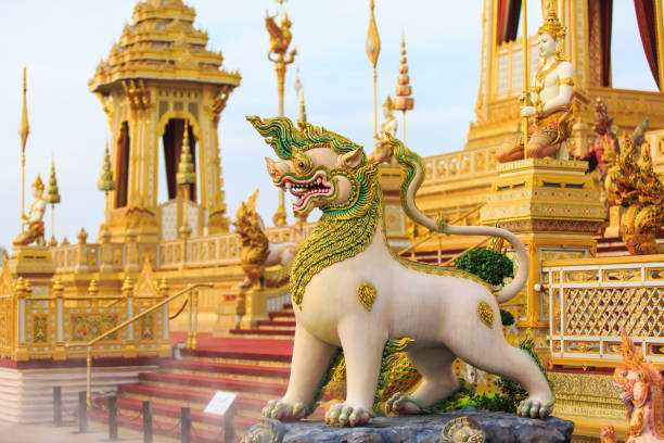 Guardian statues at the royal crematorium of His Majesty late King Bhumibol Adulyadej built Bangkok, Thailand - November 12, 2017 :Guardian statues at the royal crematorium of His Majesty late King Bhumibol Adulyadej built for the royal funeral at Sanam Luang. funeral home chairs stock pictures, royalty-free photos & images