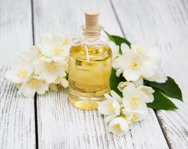 istock Massage oil with jasmine flowers 876895744