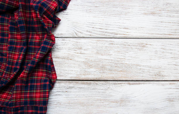 istock Checkered napkin on a wooden background 876895804