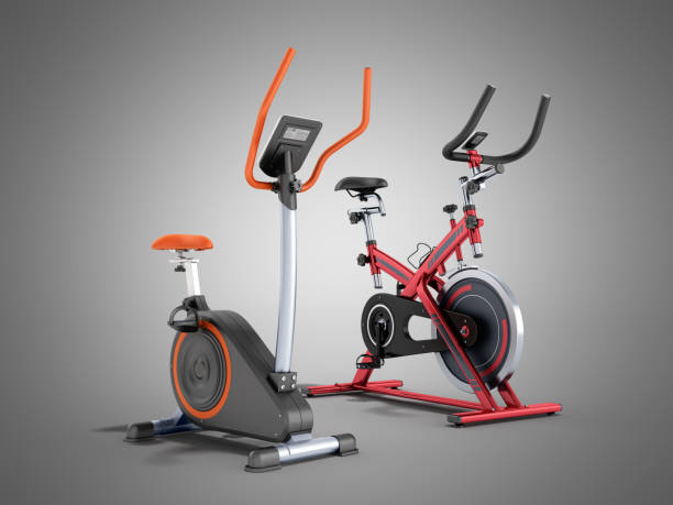istock Two modern sport exercise bike yellow purple 3d render on grey background 876896078