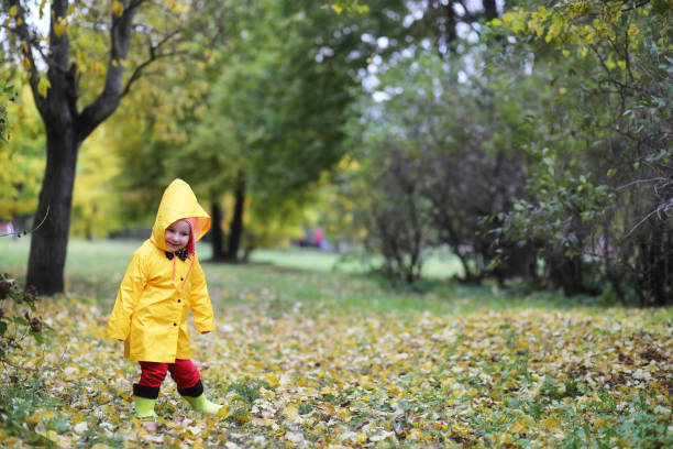 istock Children in the autumn park walk 876900458