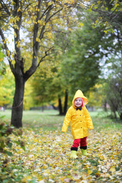 istock Children in the autumn park walk 876902604