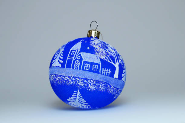 istock Christmas decoration - Blue Christmas ball with a pattern on a white background. 876902626