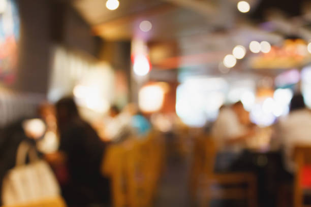 istock Restaurant cafe or coffee shop interior with people abstract blur background 876902946