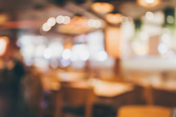 istock Restaurant cafe or coffee shop interior with people abstract blur background 876902954