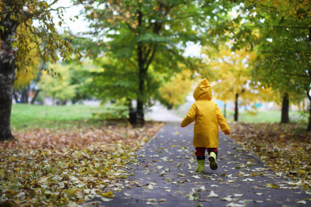 istock Children in the autumn park walk 876903166