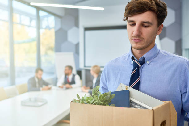istock Sad Young Man leaving Job 876903746