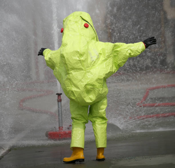 istock yellow protective suit with air filtering system to breathe duri 876903958
