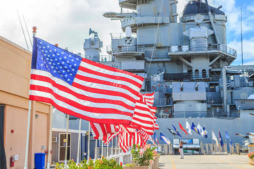 HONOLULU, OAHU, HAWAII, USA - AUGUST 21, 2016:American flags at Missouri Battleship Memorial in Pearl Harbor Honolulu Hawaii, Oahu island of United States. National historic patriotic landmark.