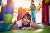 Kids having fun in inflatable castle playground