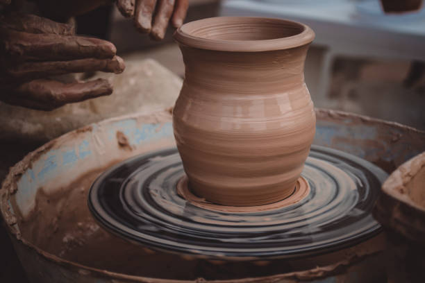 istock Master class on modeling of clay on a potter's wheel 876914766