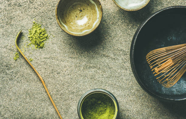 istock Japanese tools for brewing matcha tea, grey concrete background 876915936