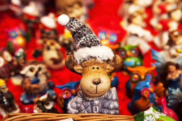 istock Lovely reindeer wearing Christmas cap and smiling 876920738