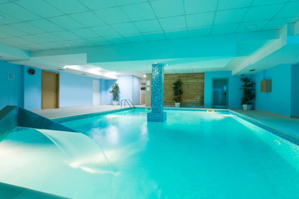istock Indoor swimming pool in hotel spa center 876923172