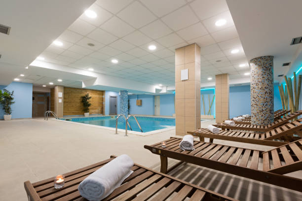 istock Indoor swimming pool in hotel spa center 876924272