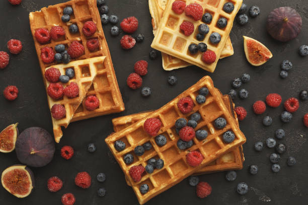 istock Round belgium waffles with berries top view 876924284