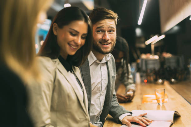 istock Friends at the counter of a bar after work 876930452