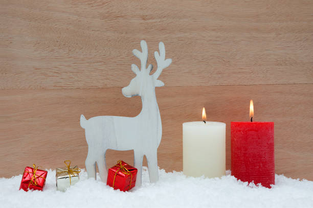 istock Christmas decorations with snow and wood background 876930512