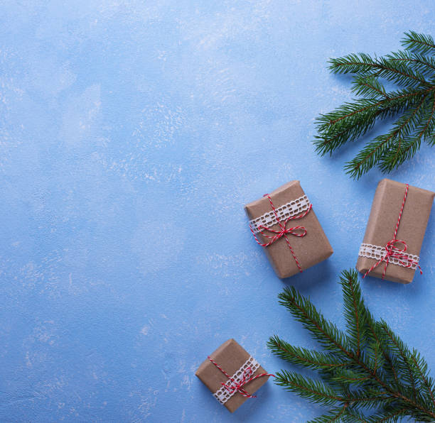 istock Christmas gift boxes in craft paper 876931462
