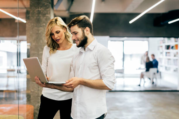istock Discussing new ideas with a coworker 876931944