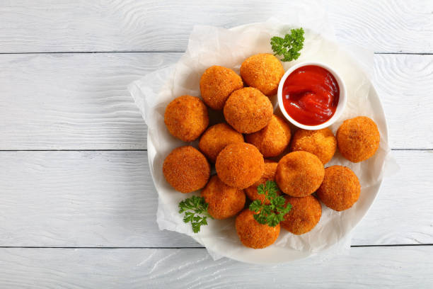 istock delicious potato croquettes with tomato sauce 876935172