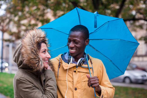 istock Embraced Couple Walking On Autumn Day 876944438