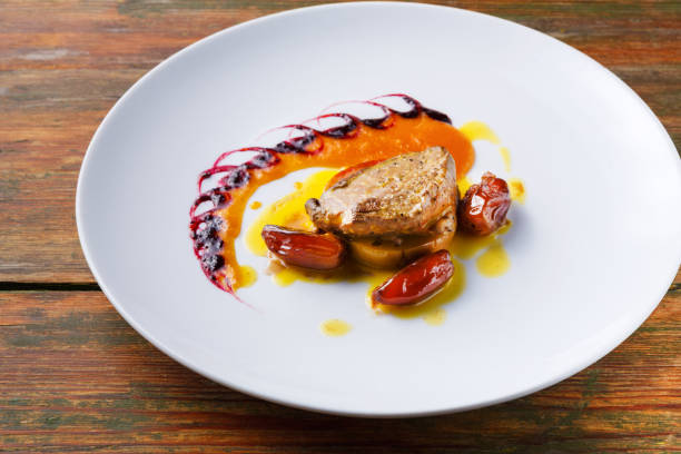 istock Roasted goose liver with date fruit and apple 876944626