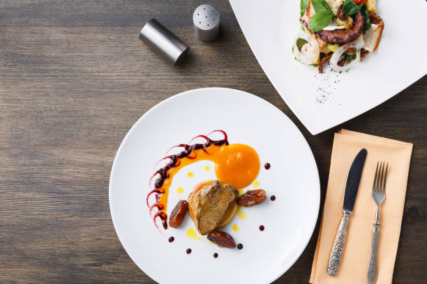 istock Roasted goose liver with date fruit and apple 876944698