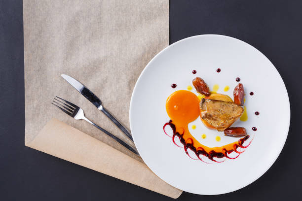 istock Roasted goose liver with date fruit and apple 876944752