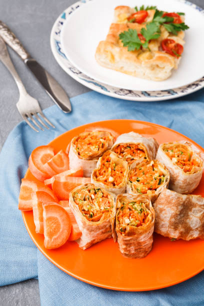 istock Rolls with vegetables and casserole on gray background. 876945186