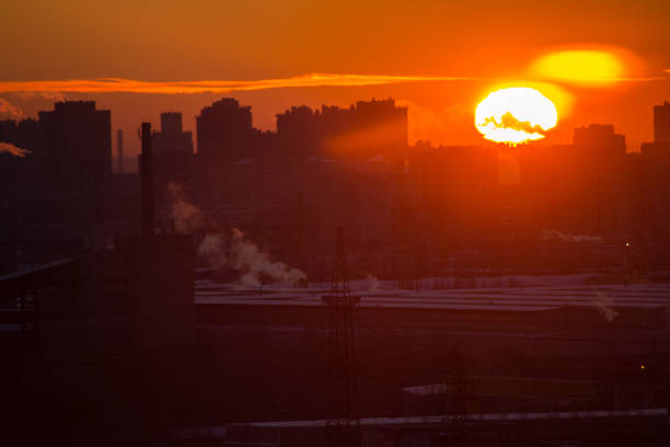 dawn in the industrial district of a larger city on a cold morning