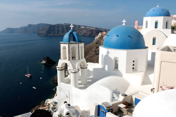 istock Blurred image of the famous 3 Blue Domes at Santorini 876949428