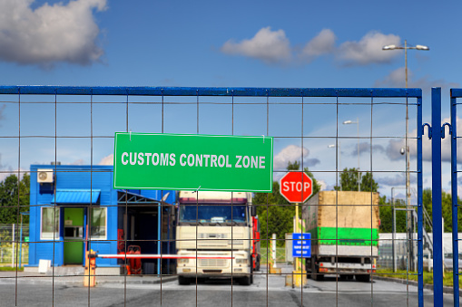 Lorries pass through the security checkpoint of the logistics complex with customs services.