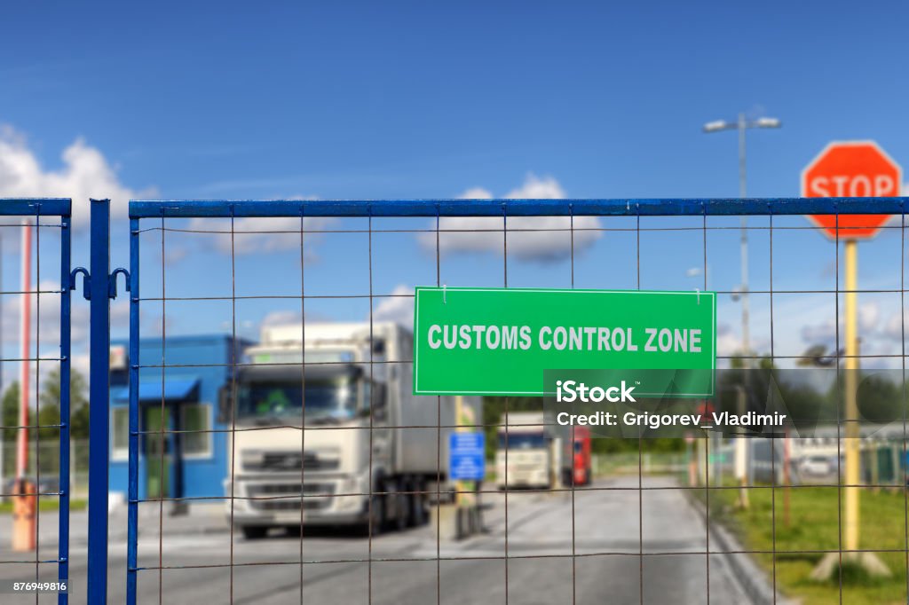 Lorries pass through checkpoint of logistics complex with customs services. Trucks pass through the checkpoint of the customs logistics terminal. Customs Stock Photo