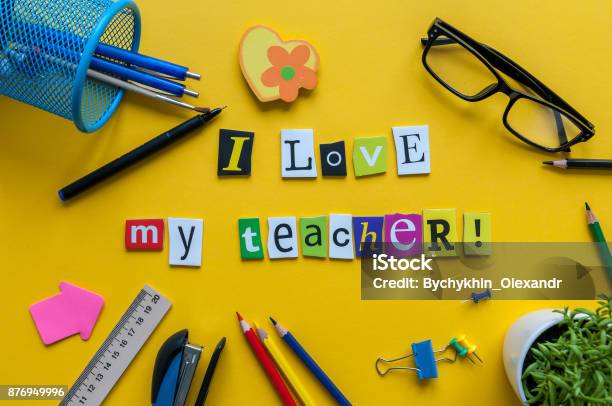 I Love My Teacher Text Made With Carved Letters On Yellow Desk With Office Or School Supplies On Pupil Table Stock Photo - Download Image Now