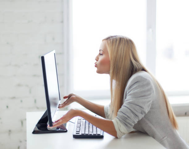 istock happy woman with laptop computer 876954434