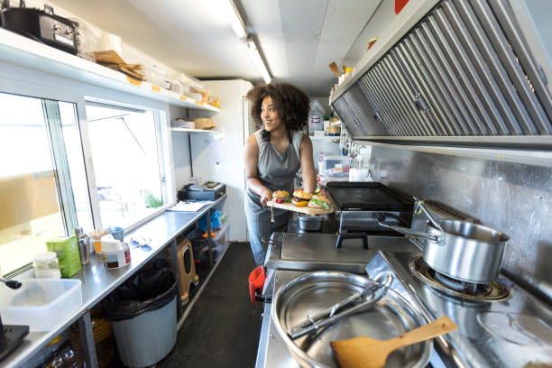 istock Food van worker making sandiches 876956716