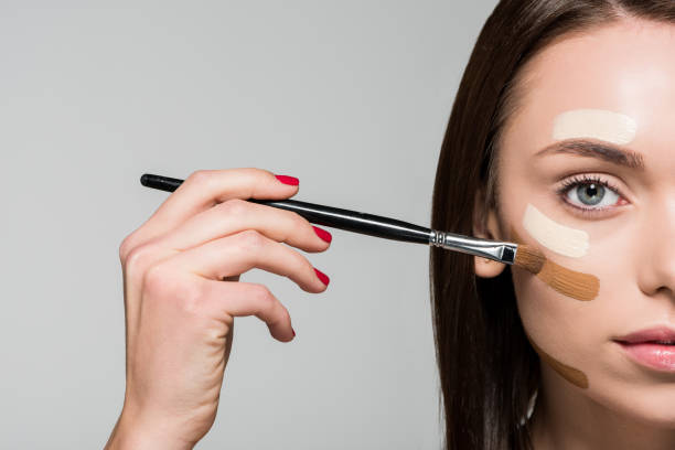 istock woman with tonal foundation on face 876957242
