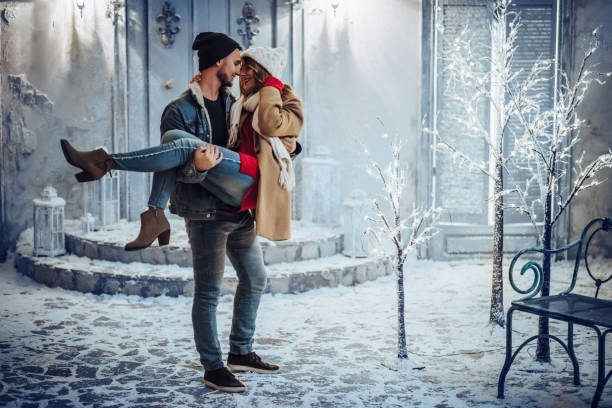 istock Young romantic couple is having fun outdoors in winter 876957456