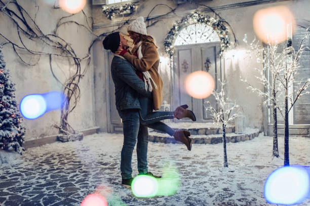 istock Young romantic couple is having fun outdoors in winter 876957606