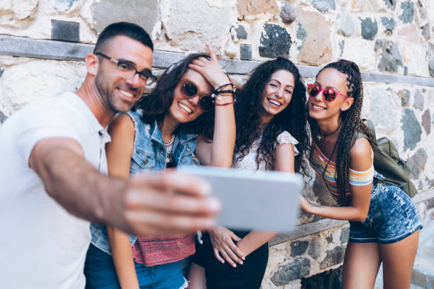 istock Group of young peope taking selfie 876957956