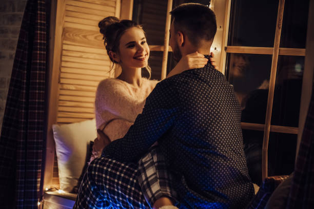 istock Young romantic couple is spending time together at home 876958938