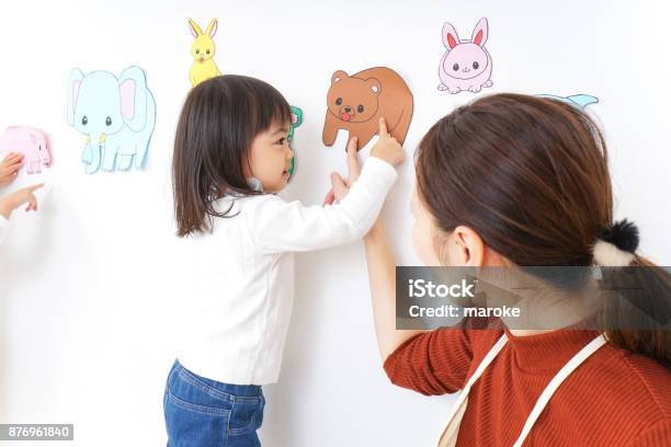 Children Playing At Kindergarten Stock Photo - Download Image Now - Child Care Worker, Asian and Indian Ethnicities, Baby - Human Age