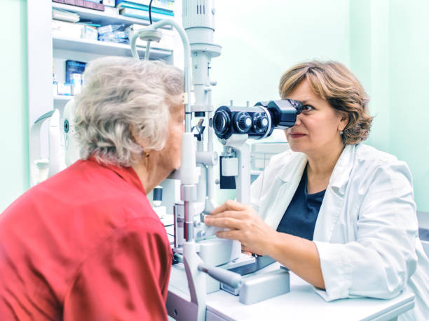 istock Senior woman visiting optician. 876962218