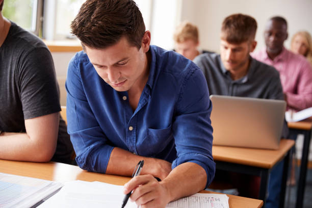 istock Mature Male Student Attending Adult Education Class 876963082