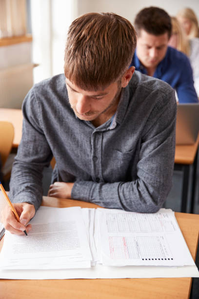 istock Mature Male Student Attending Adult Education Class 876963084
