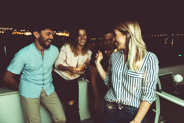 istock Friends at party 876965300