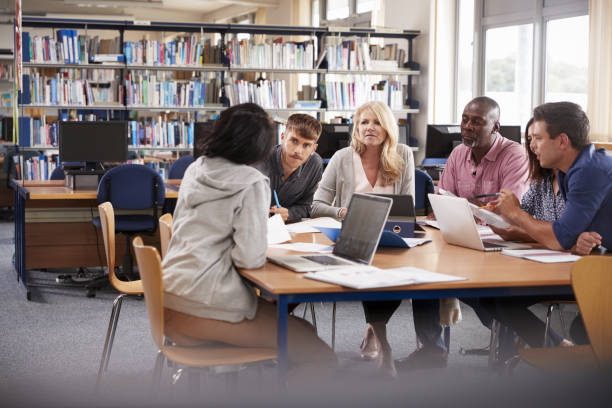 istock Group Of Mature College Students Collaborating On Project 876966424